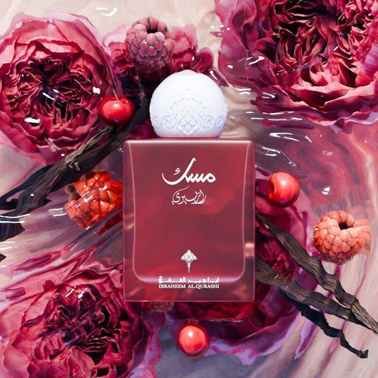 Worood Oud Fragrances Masak Fragrance Bottle Surrounded by Red Flowers and Berries, Inspired by Tom Ford Perfume Oud Wood